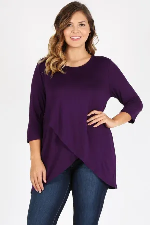 Loose fit three quarter sleeve solid tunic top with waist length overlap hem